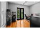 Well-lit office space with modern desk, shelving, and french doors leading to the outside at 17630 Brown Rd, Odessa, FL 33556