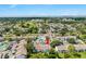 Aerial view of residential complex featuring a swimming pool, parking, and manicured lawns at 2075 Lakewood Club S Dr # 6A, St Petersburg, FL 33712