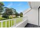 Balcony view overlooking green space, trees and blue skies at 2075 Lakewood Club S Dr # 6A, St Petersburg, FL 33712