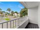 Condo balcony with neighborhood and palm tree views at 2075 Lakewood Club S Dr # 6A, St Petersburg, FL 33712