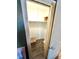 A view inside of a bedroom closet with wood floors and white walls at 2172 University S Dr, Clearwater, FL 33764