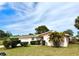 Charming single-story home with a well-manicured lawn, lush landscaping, and lovely curb appeal at 2172 University S Dr, Clearwater, FL 33764