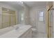 Well-lit bathroom with a glass shower and a large mirror over the vanity at 2333 Appaloosa Cir, Sarasota, FL 34240