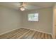 Bright bedroom with wood floors, a ceiling fan, and natural light at 2333 Appaloosa Cir, Sarasota, FL 34240