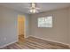 Bedroom with wood floors, a ceiling fan, and a closet at 2333 Appaloosa Cir, Sarasota, FL 34240