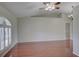 Spacious living room with wood floors, plantation shutters, and high ceilings at 2333 Appaloosa Cir, Sarasota, FL 34240