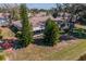 An aerial shot showcasing the home's exterior and the mature trees surrounding the property at 2609 Locksley St, Sun City Center, FL 33573