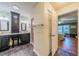 Beautifully appointed bathroom featuring a dual vanity, granite countertop, and step-in shower at 2609 Locksley St, Sun City Center, FL 33573