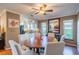 Cozy dining area featuring an oval table, six chairs, and stylish decor adjacent to the kitchen at 2609 Locksley St, Sun City Center, FL 33573