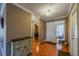 Inviting entryway featuring hardwood floors, neutral walls, and decorative accents at 2609 Locksley St, Sun City Center, FL 33573