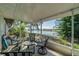 Relaxing screened patio offering stunning views of the community lake and golf course at 2609 Locksley St, Sun City Center, FL 33573