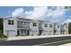 Modern townhome exterior shows light blue paint, grey roof, and a two car garage at 2752 Newbern Banks Dr, Bradenton, FL 34208