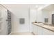 Bathroom featuring a shower, double sink vanity, granite countertops, and modern fixtures at 2955 Rock Sound St, Bradenton, FL 34208