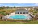 Aerial view of a community pool and lounge area, surrounded by lush landscaping at 2955 Rock Sound St, Bradenton, FL 34208