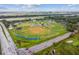 Overhead view of baseball fields with well-maintained grass, baseball diamond, and fencing at 3934 Doral Dr, Tampa, FL 33634