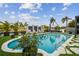 A stunning backyard oasis featuring a sparkling pool, lush landscaping, and lounge chairs for ultimate relaxation at 3934 Doral Dr, Tampa, FL 33634