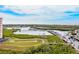 Waterfront view with a boardwalk, marina, and a glimpse of the intercoastal waterway at 4516 Seagull Dr # 303, New Port Richey, FL 34652