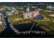 High angle of the condominium and adjacent waterfront with a boat dock at 4516 Seagull Dr # 405, New Port Richey, FL 34652