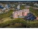 An aerial view showcases the condominium's pool, parking, and proximity to residential area at 4516 Seagull Dr # 405, New Port Richey, FL 34652