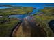 Panoramic aerial shot of verdant mangrove forests intertwined with tranquil waterways under a clear blue sky at 4516 Seagull Dr # 405, New Port Richey, FL 34652