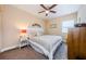 Bedroom featuring a ceiling fan, carpet, and a window for natural light at 4516 Seagull Dr # 405, New Port Richey, FL 34652