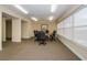 Well-lit conference room features a round table and comfortable chairs, perfect for meetings at 4516 Seagull Dr # 405, New Port Richey, FL 34652