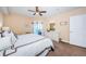 Well-lit main bedroom features a balcony and a ceiling fan, offering a relaxing space at 4516 Seagull Dr # 405, New Port Richey, FL 34652