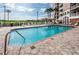 Beautiful community pool with lounge chairs and umbrellas and access to outdoor grills at 4516 Seagull Dr # 405, New Port Richey, FL 34652