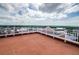 Expansive rooftop deck with panoramic views of the water and blue sky at 4516 Seagull Dr # 405, New Port Richey, FL 34652