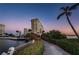 Scenic exterior view showcasing a boardwalk and waterfront of the beautiful condominium complex at 4525 Cove Cir # 805, St Petersburg, FL 33708