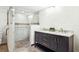 Bathroom boasts a double vanity with modern fixtures and a glass-enclosed shower with attractive tile work at 4801 Umber Ct, Tampa, FL 33624