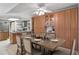 Dining room features a wooden table set for six and built in wooden cabinets at 4801 Umber Ct, Tampa, FL 33624