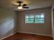 Bedroom features hardwood floors, a ceiling fan, and natural light at 4802 W San Jose St, Tampa, FL 33629