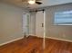 Bedroom boasts hardwood floors, and a modern sliding barn door to the Primary bathroom at 4802 W San Jose St, Tampa, FL 33629