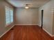 Inviting living room with hardwood floors, ample natural light from large window, and neutral wall paint at 4802 W San Jose St, Tampa, FL 33629