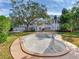 Backyard pool featuring a large in-ground pool and a spacious grassy area, surrounded by lush landscaping at 5001 S Shore Crest Cir, Tampa, FL 33609