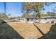 View of the home's backyard featuring a mature tree and partial fencing at 5020 16Th N Ave, St Petersburg, FL 33710