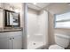 Bathroom featuring a walk-in shower, granite counters, and modern fixtures at 5020 16Th N Ave, St Petersburg, FL 33710