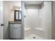 Bathroom featuring a walk-in shower, granite counters, and modern fixtures at 5020 16Th N Ave, St Petersburg, FL 33710