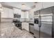 Close-up of a renovated kitchen featuring stainless steel appliances and granite countertops at 5020 16Th N Ave, St Petersburg, FL 33710