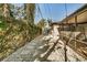 Landscaped backyard with stone pathway leading to gate at 525 Lamara Ne Way, St Petersburg, FL 33704