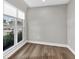 Bright bedroom featuring wood floors, a large window, and neutral walls at 525 Lamara Ne Way, St Petersburg, FL 33704