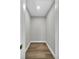 Walk-in closet with wood flooring, white trim, and a clean, simple design at 525 Lamara Ne Way, St Petersburg, FL 33704