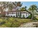 Exterior view of the home showing landscaping and curb appeal at 525 Lamara Ne Way, St Petersburg, FL 33704