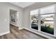 Entryway with wood flooring, white trim, and a view of the front exterior through a window at 525 Lamara Ne Way, St Petersburg, FL 33704