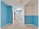 Bedroom with white and blue painted walls, carpet, and a closet at 6929 Breezy Palm Dr, Riverview, FL 33578