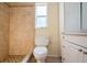 Bathroom with shower, toilet and white vanity at 7353 Knoll Dr, New Port Richey, FL 34653