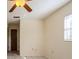 Bright bedroom with tile floors and ceiling fan at 7353 Knoll Dr, New Port Richey, FL 34653