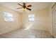 Bright bedroom with tile floor and ceiling fan at 7353 Knoll Dr, New Port Richey, FL 34653