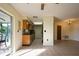 View of kitchen and living area with tile floors at 7353 Knoll Dr, New Port Richey, FL 34653